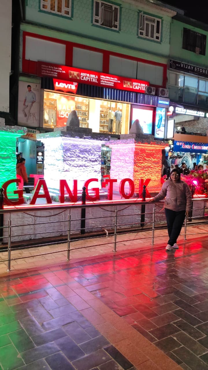 Sangeeta Kumari at the Gangtok sign at night