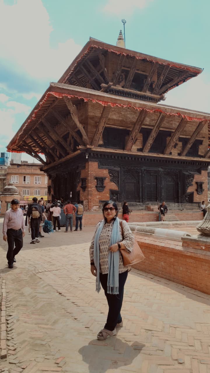 Sangeeta Kumari walking in a historic square in Nepal